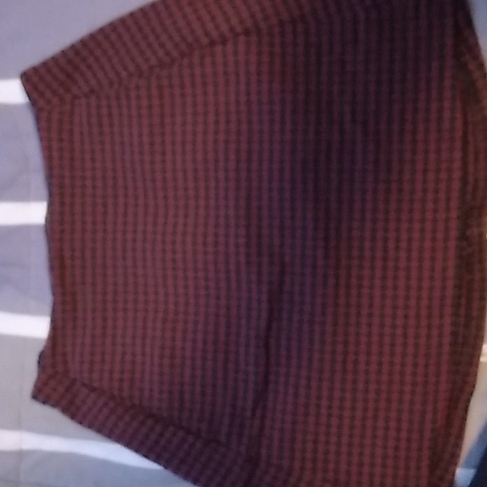 Small black and red plaid skirt has pockets